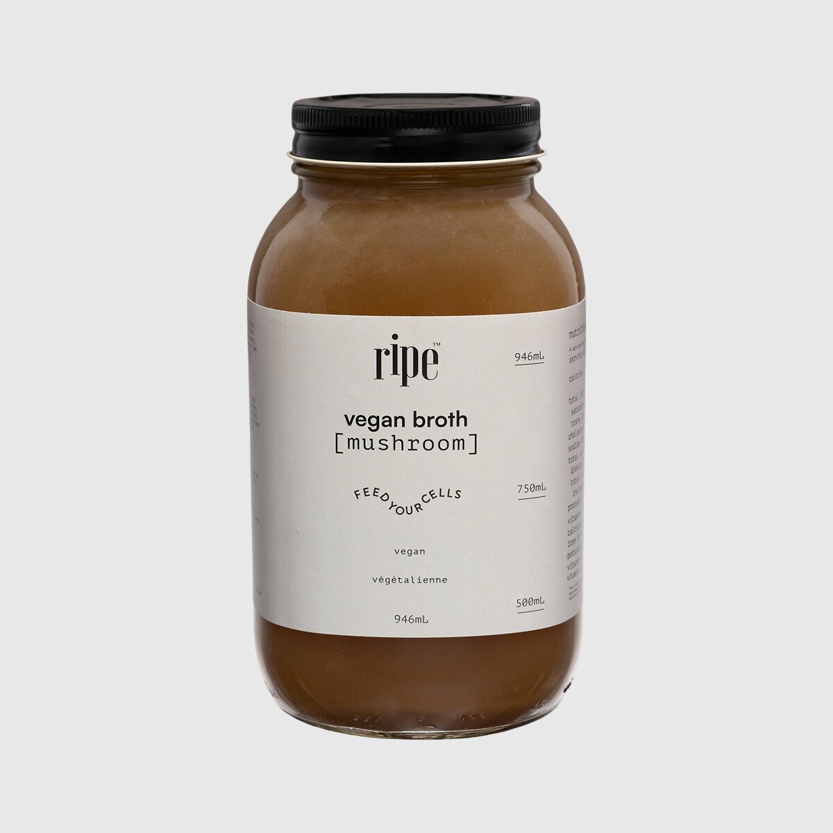 Mushroom and herb vegan broth in a glass jar