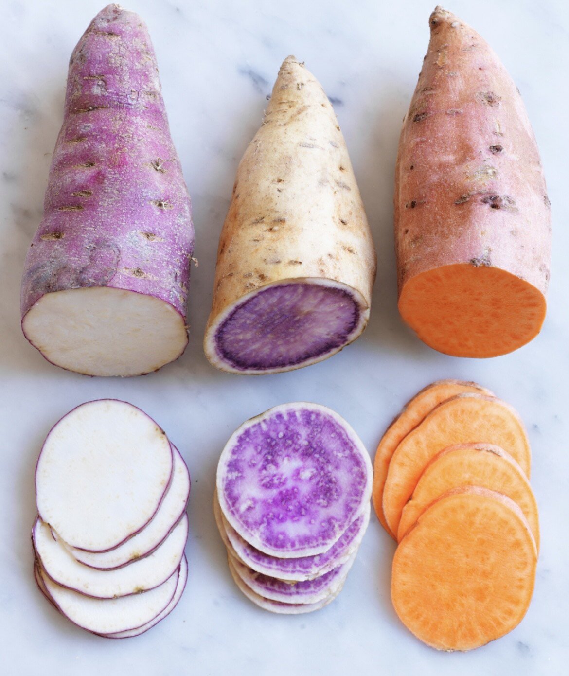 A bowl of orange butternut squash soup with chilli oil and herbs