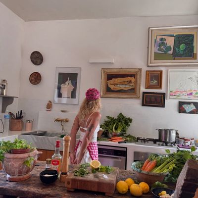 Sinead McInerney, founder of RIPE Lifestyle Europe, cooking in her Lisbon kitchen with fresh produce